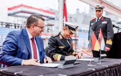 Signatures_for_the_handover_of_AL-AZIZ_by_CEO_Oliver_Burkhard_and_Vice_Admiral_Atwa-1024x664.j...jpg