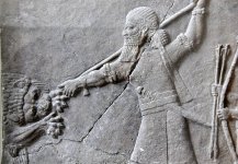 Ashurbanipal_hunts_a_lion._Bas-relief_from_his_north_palace_at_Nineveh,_Iraq._7th_century_BC._...jpg